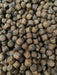 floating expander pellets used as surface fish feed. Garden pond Koi 
carp food 