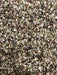 Crushed hemp seed dry particle used for fishing, showing fine oily particles ideal for groundbait and mixes. UK